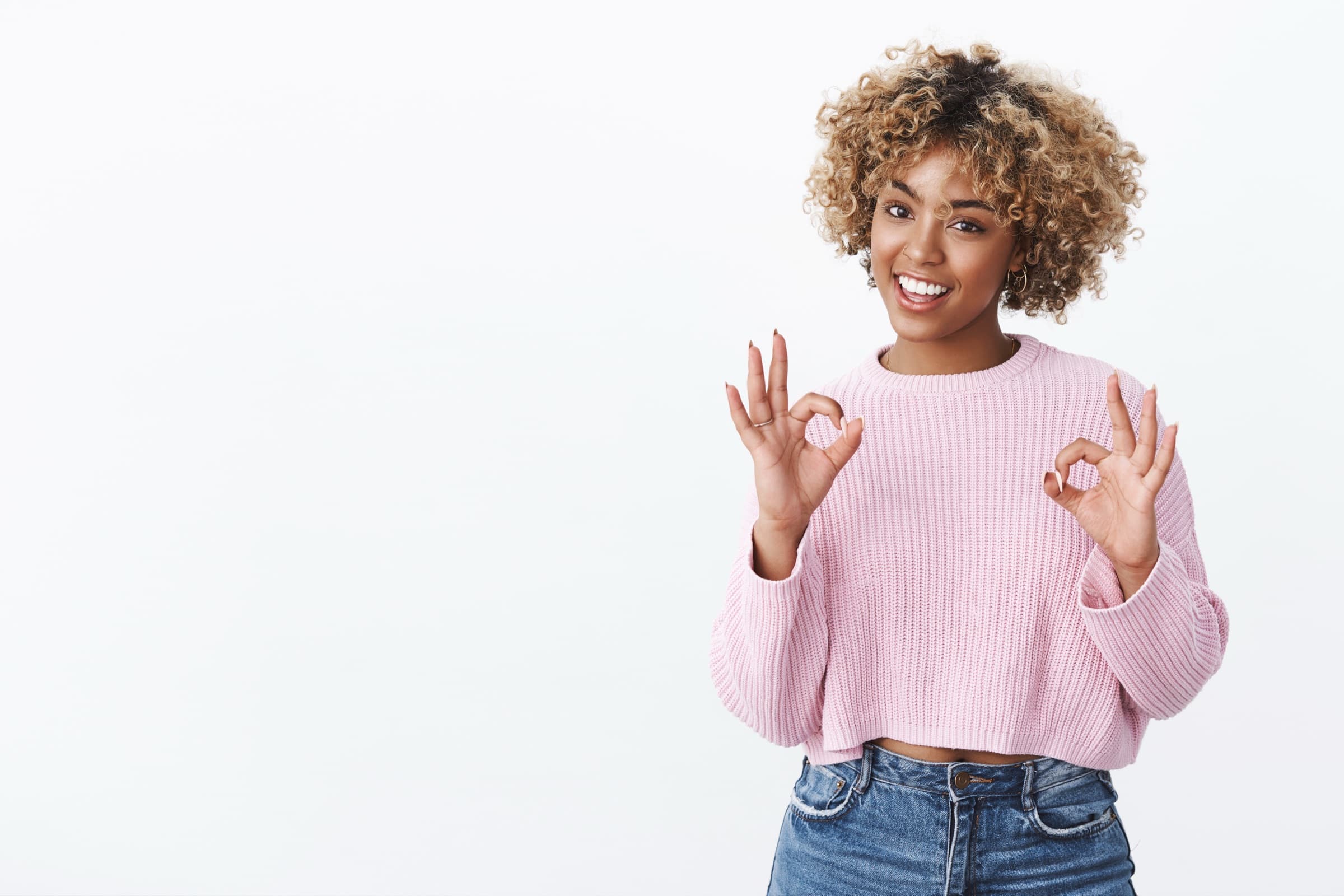 A person giving an OK hand gesture
